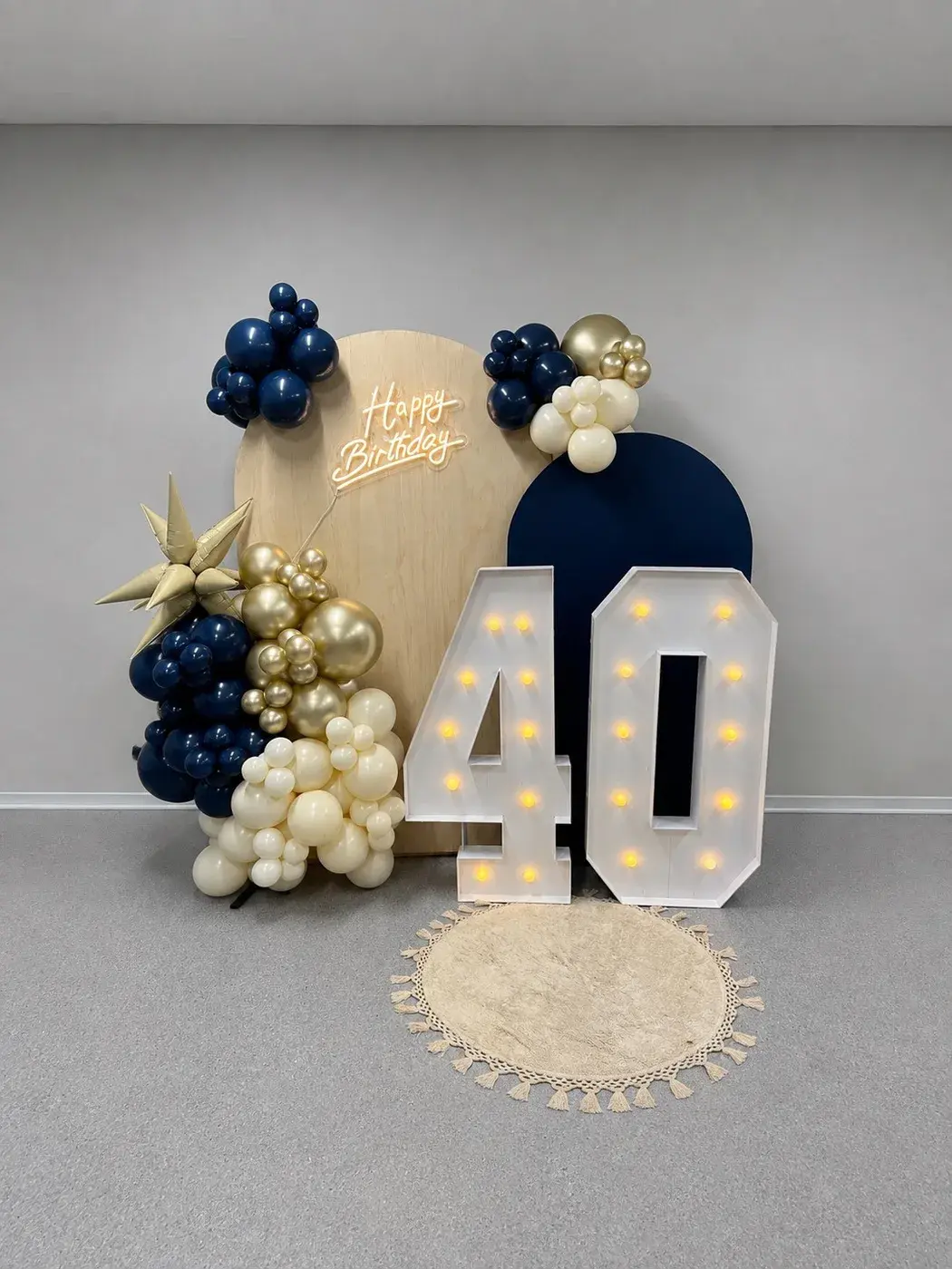 Navy and gold 40 marquee numbers with an arched backdrop